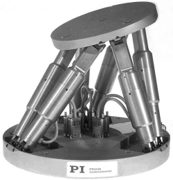 Hexapod for satellite dish reflector and a feed alignment